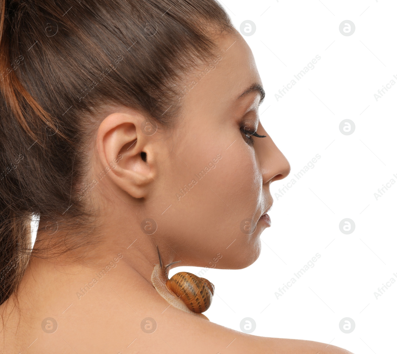 Photo of Beautiful young woman with snail on her neck against white background
