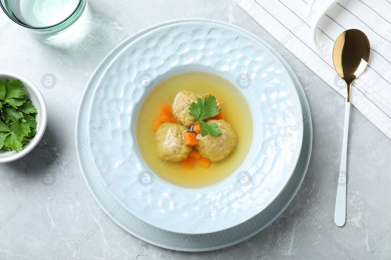 Photo of Flat lay composition with Jewish matzoh balls soup on light table