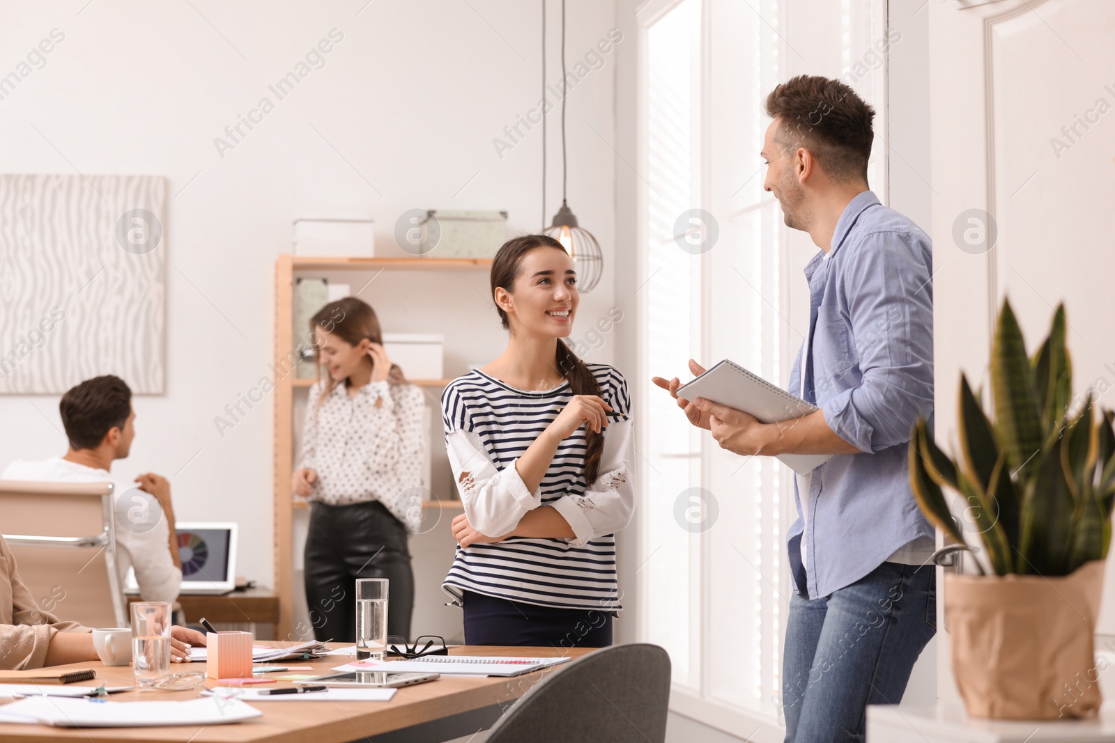 Photo of Team of professional journalists working in office