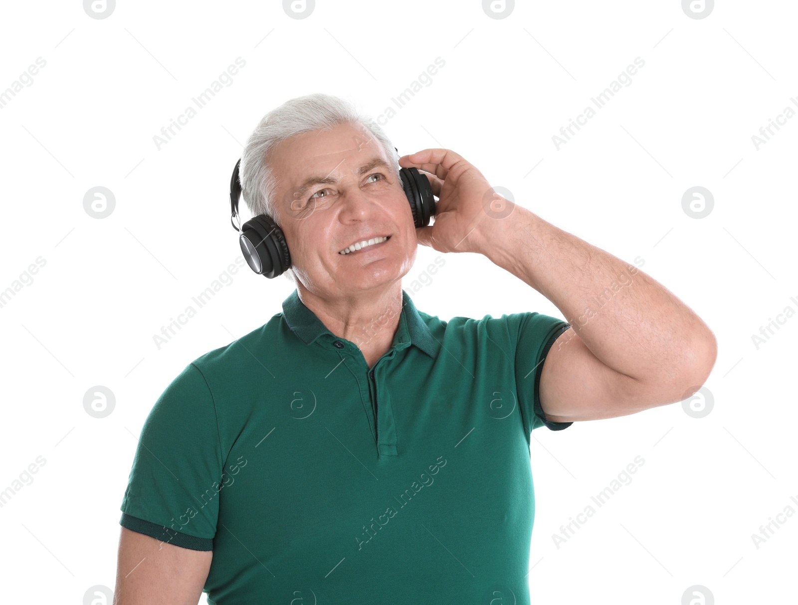 Photo of Mature man enjoying music in headphones on white background