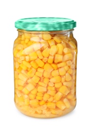 Photo of Glass jar with pickled corn isolated on white