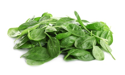 Pile of fresh green healthy baby spinach leaves on white background