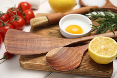 Composition with cooking utensils on white wooden table, closeup