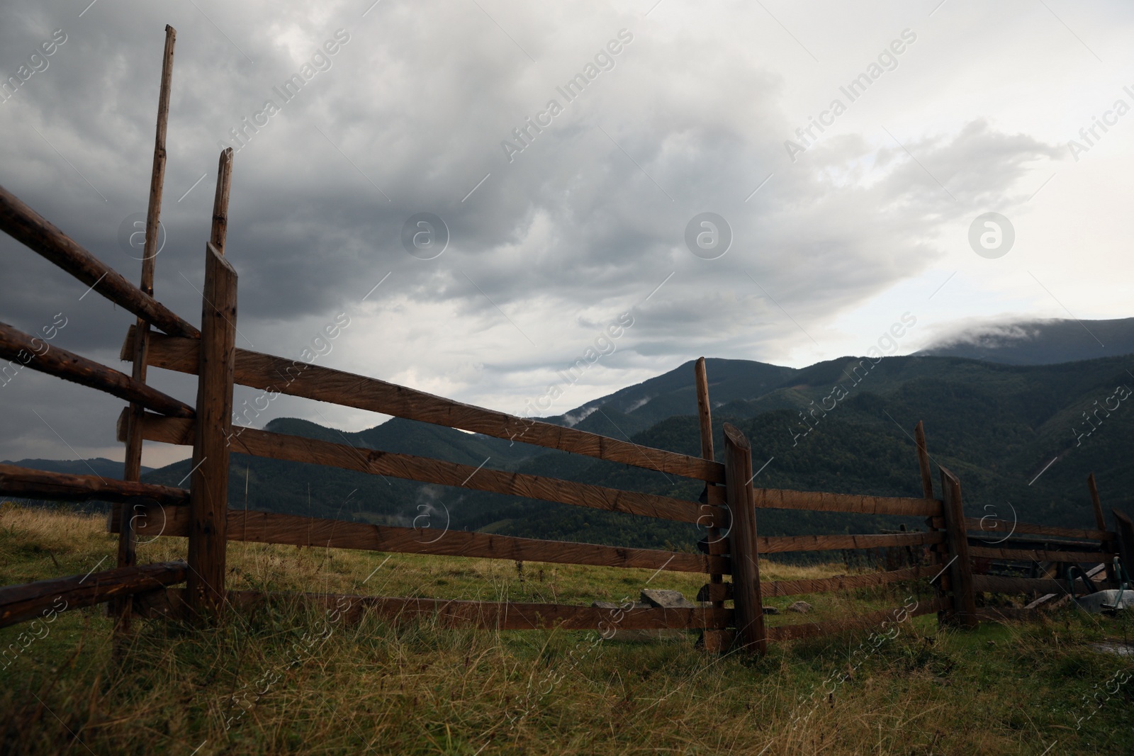 Photo of Beautiful view of mountain countryside with wooden fence