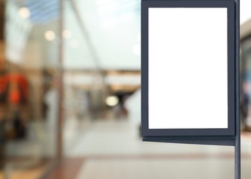 Blank advertising board in shopping mall. Mockup for design