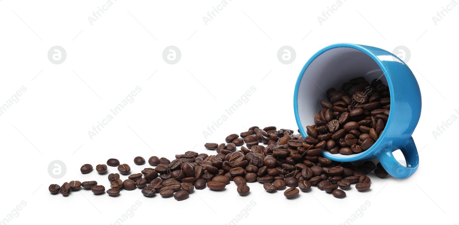 Photo of Overturned cup with roasted coffee beans on white background