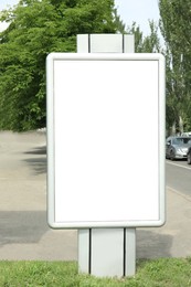 Photo of Blank citylight poster outdoors. Advertising board design