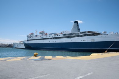 Photo of Modern ferry in sea port on sunny day