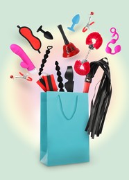 Image of DIfferent sex toys and accessories falling into paper shopping bag on color background