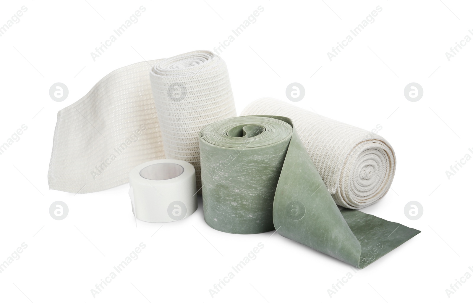 Photo of Medical bandage rolls and sticking plaster on white background