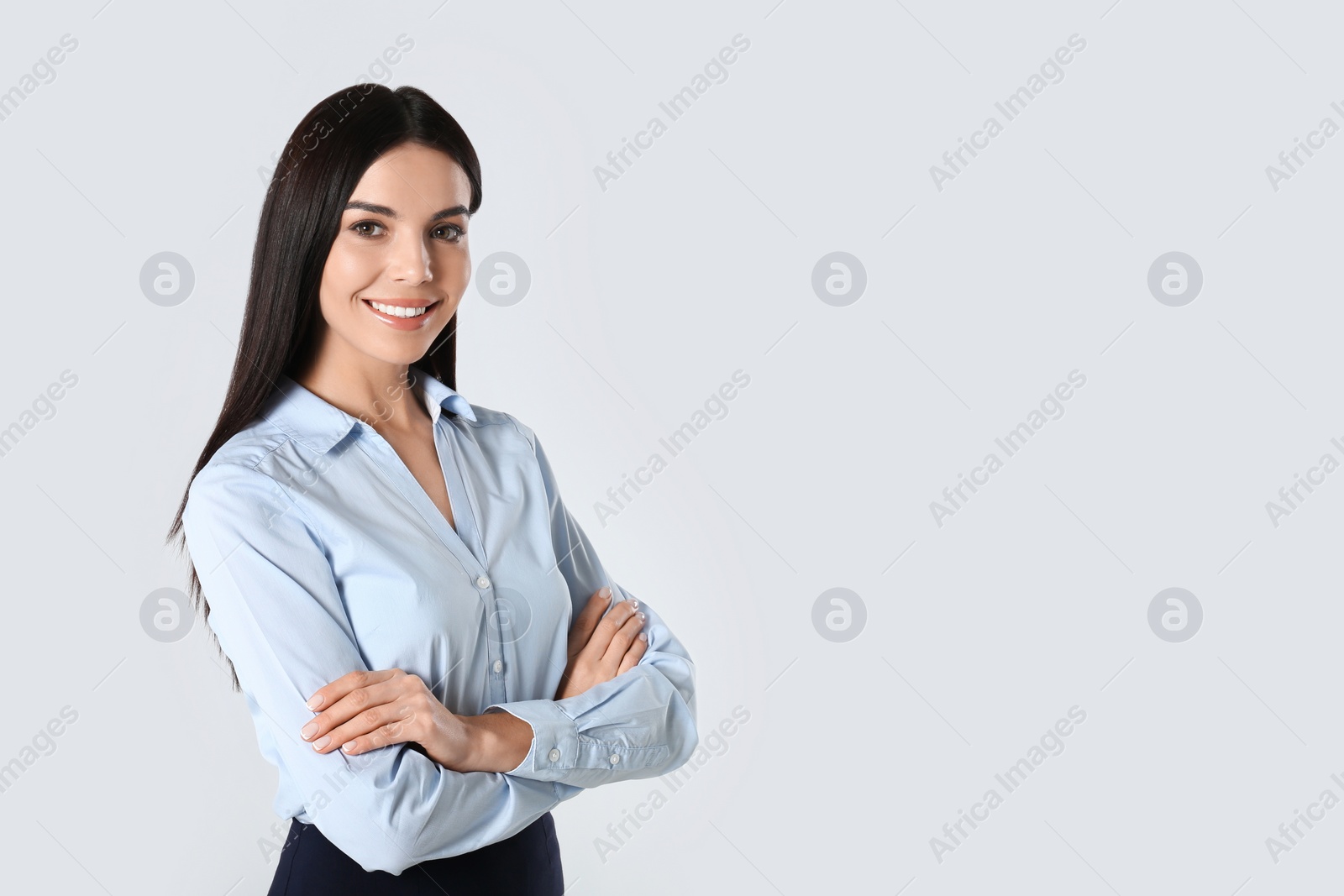 Photo of Portrait of young businesswoman on white background. Space for text