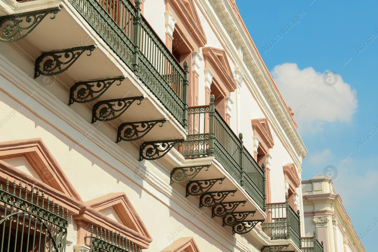 Photo of Exterior of beautiful building with windows and balconies