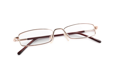 Photo of Glasses with corrective lenses on white background. Vision problem