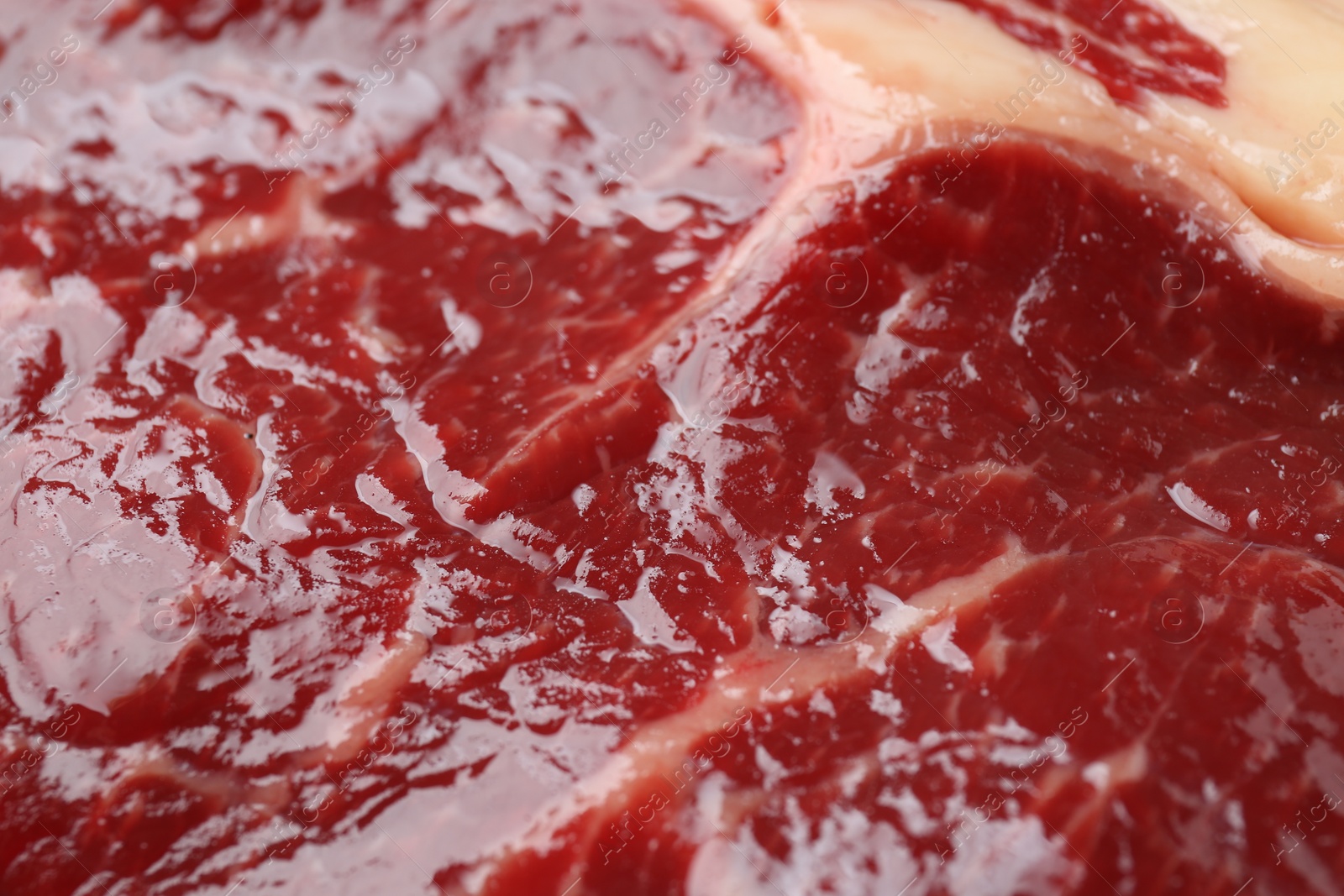 Photo of Texture of fresh beef meat as background, closeup