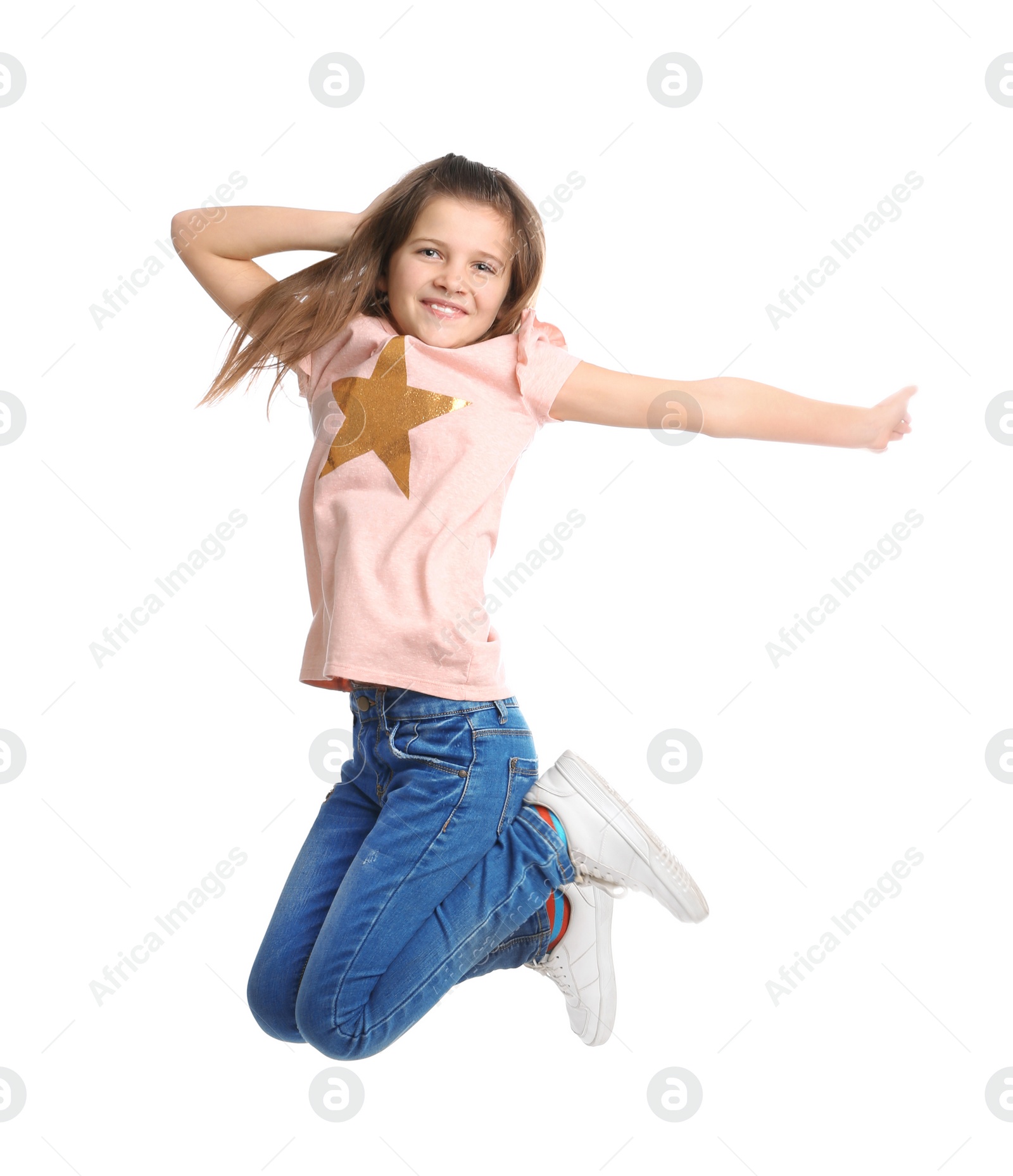 Photo of Full length portrait of preteen girl jumping on white background