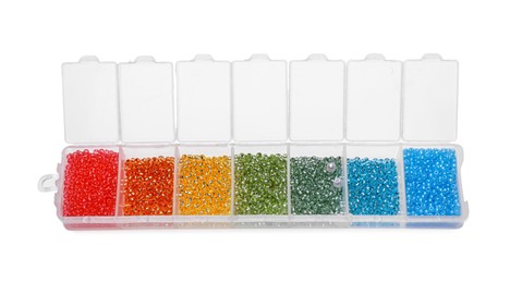Photo of Plastic organizer with different beads isolated on white, above view