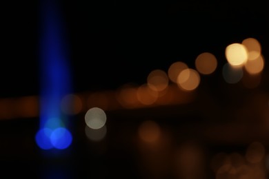 Blurred view of city with street lights at night. Bokeh effect