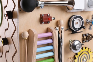 Photo of Closeup view of busy board. Baby sensory toy