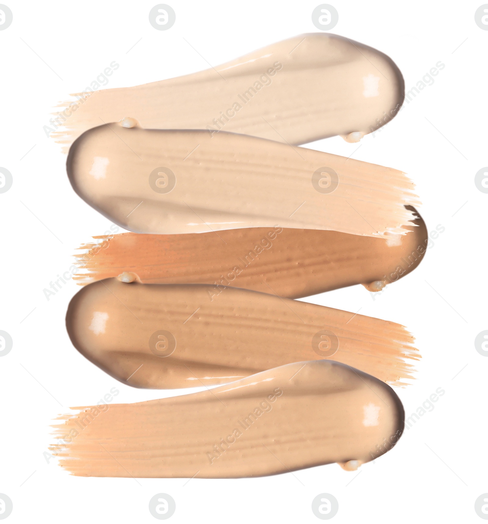 Image of Set of different foundation shades on white background, top view