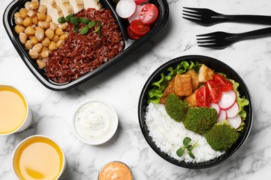 Photo of Flat lay composition with healthy takeaway food on white marble table