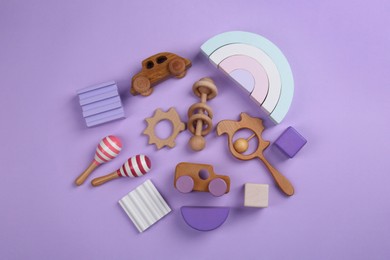 Photo of Different children's toys on violet background, flat lay