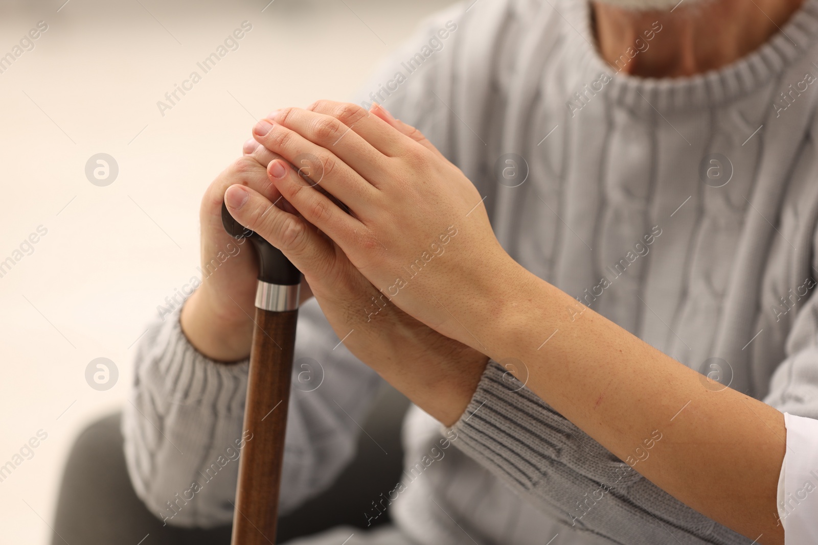 Photo of Health care and support. Nurse with elderly patient, closeup