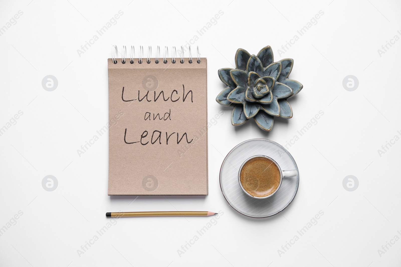 Image of Lunch and Learn concept. Composition with notebook and coffee on white background, top view