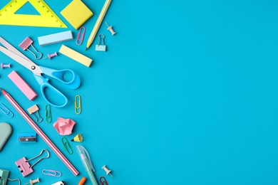 Different school stationery items on light blue background, flat lay with space for text. Back to school