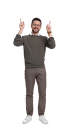 Photo of Handsome bearded businessman in eyeglasses pointing at something on white background