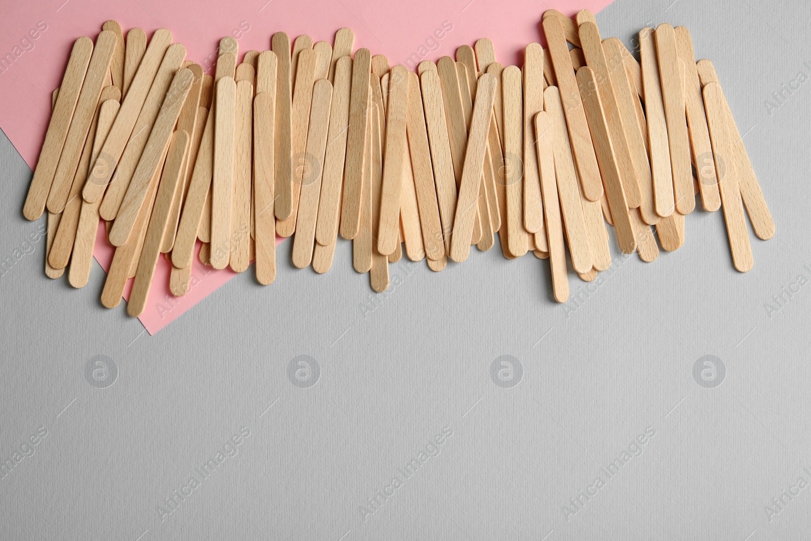 Photo of Pile of spatulas on color background, flat lay. Space for text