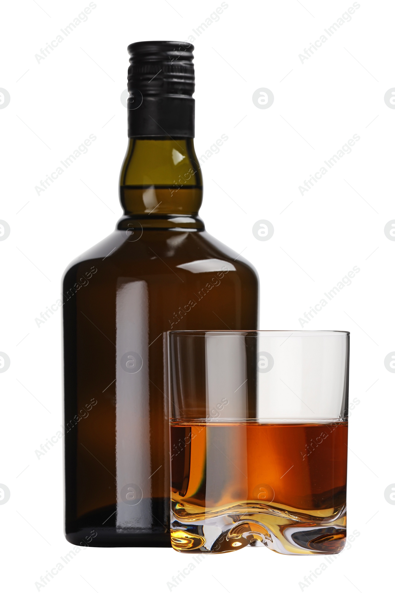 Photo of Glass and bottle of whiskey isolated on white