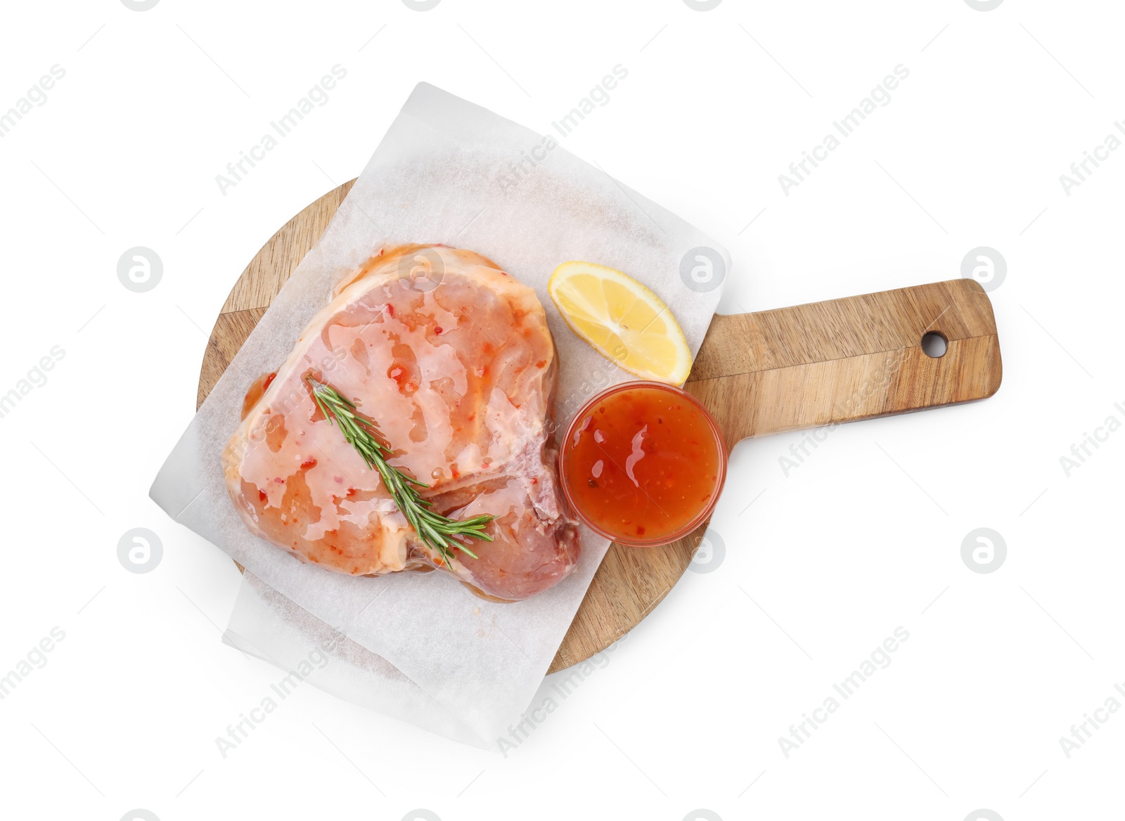 Photo of Board with raw meat, marinade, lemon and rosemary isolated on white, top view