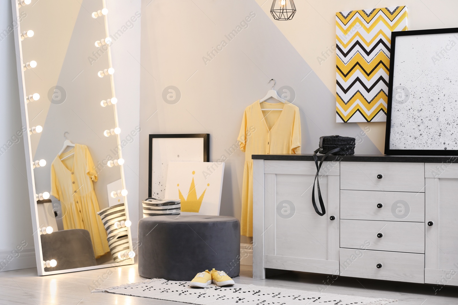 Photo of Modern chest of drawers in dressing room. Interior design