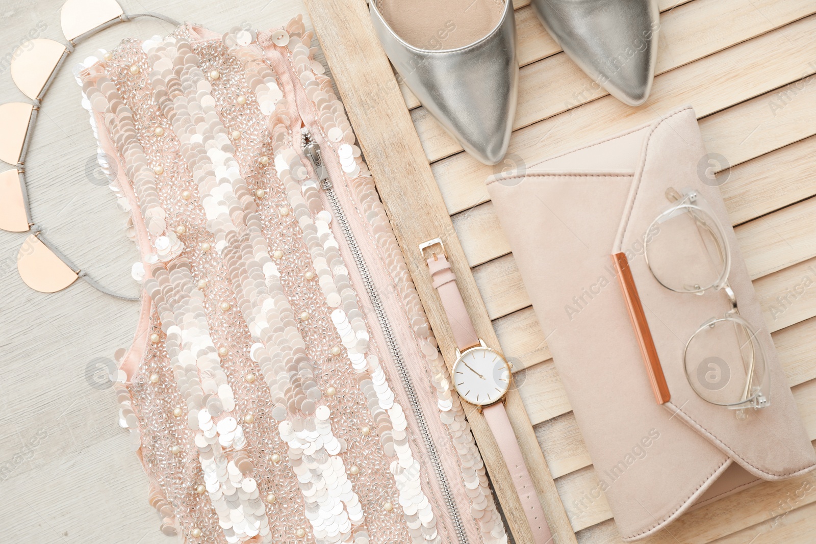 Photo of Flat lay composition with stylish outfit for woman on wooden background