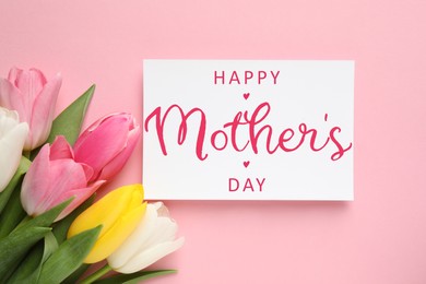 Happy Mother's Day greeting card and beautiful tulip flowers on pink background, flat lay