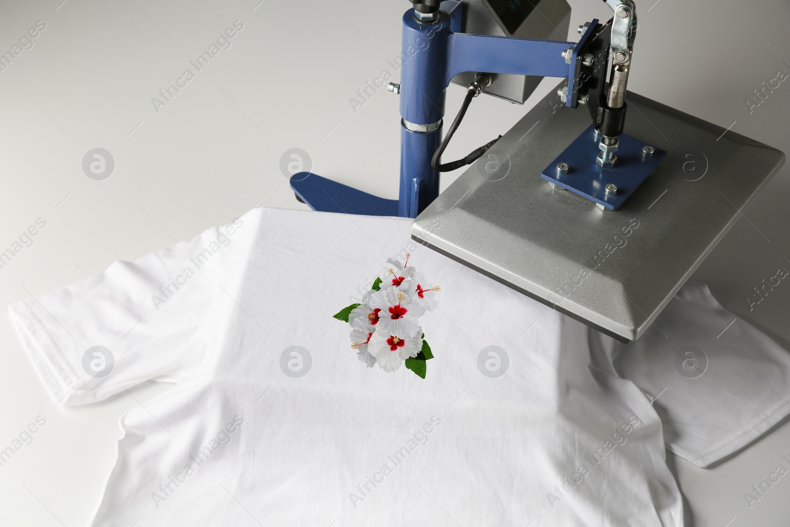 Image of Custom t-shirt. Using heat press to print image of beautiful hibiscus flowers