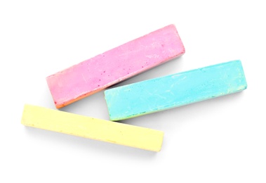 Color pieces of chalk on white background