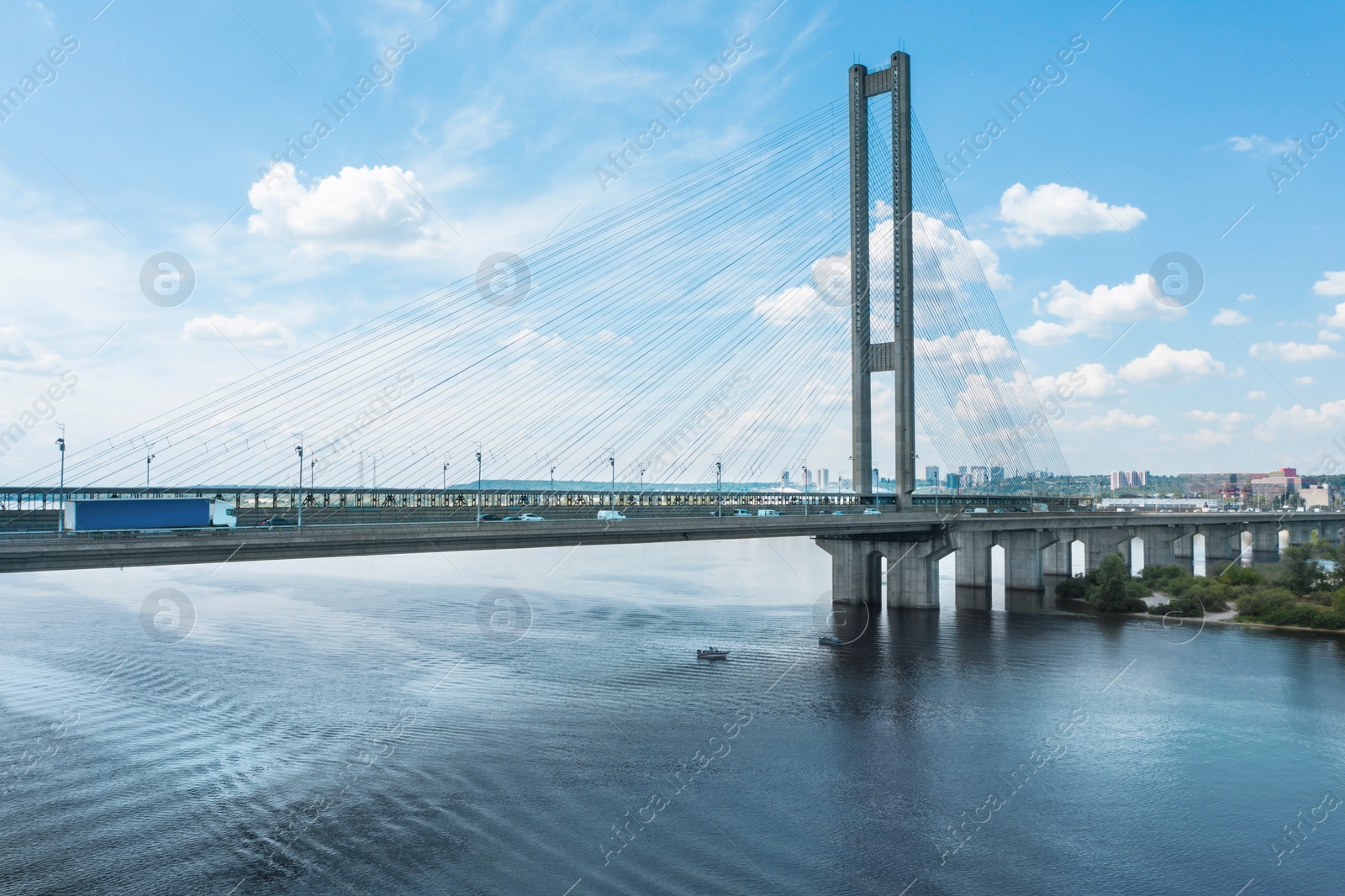 Image of Aerial view of modern bridge over river