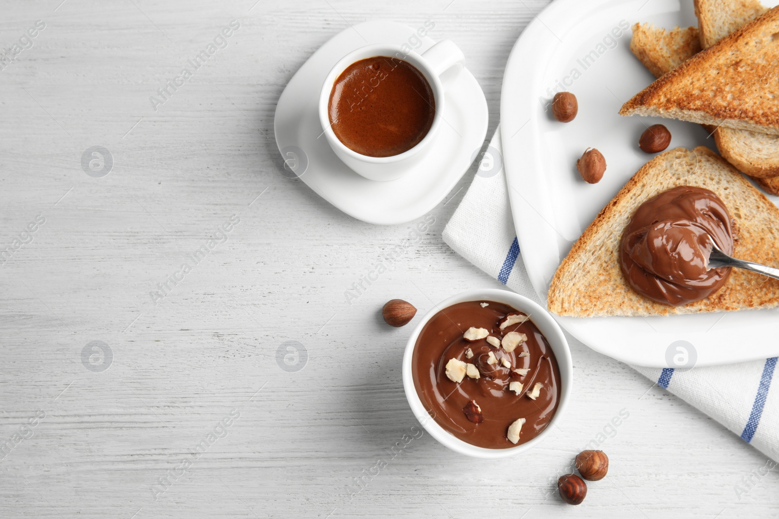 Photo of Sweet chocolate mousse and coffee served on wooden table, flat lay. Space for text