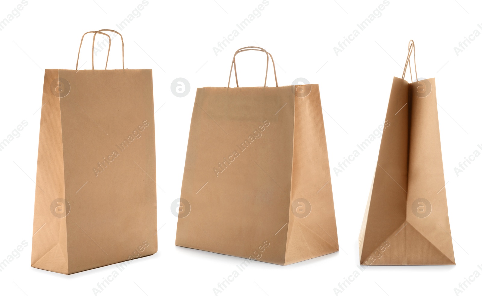 Image of Set with kraft paper bags on white background