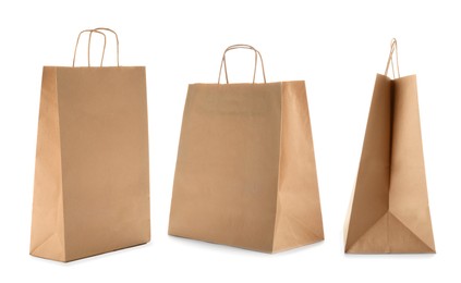 Image of Set with kraft paper bags on white background