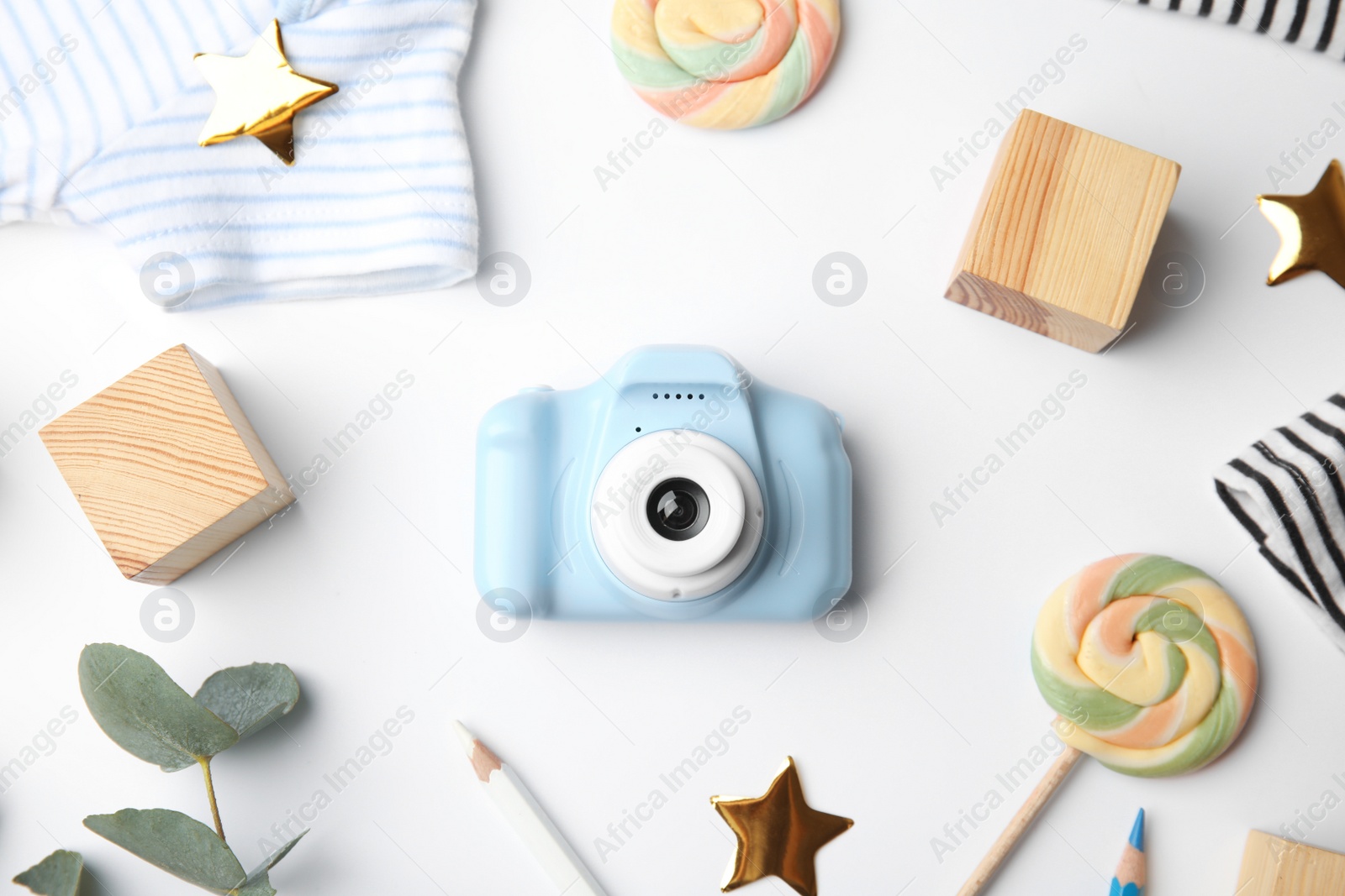 Photo of Composition with toy camera on white background, top view. Future photographer
