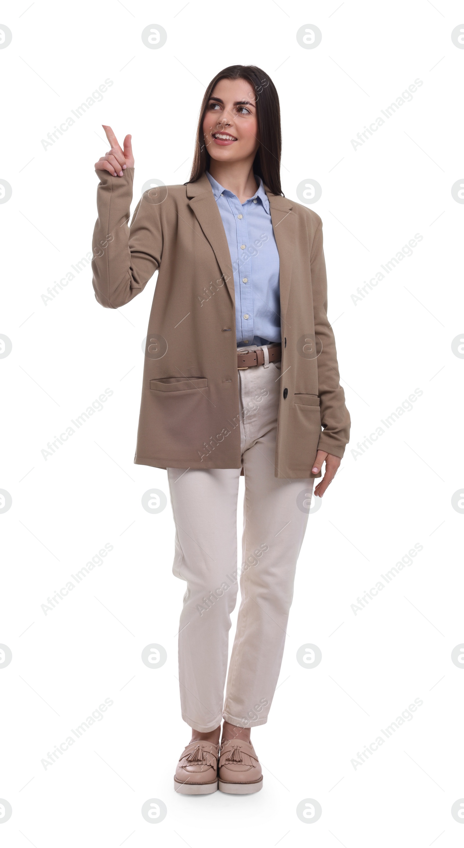 Photo of Beautiful businesswoman pointing at something on white background