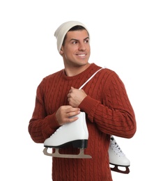 Photo of Happy man with ice skates on white background