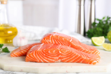 Photo of Fresh raw salmon on stone board. Fish delicacy
