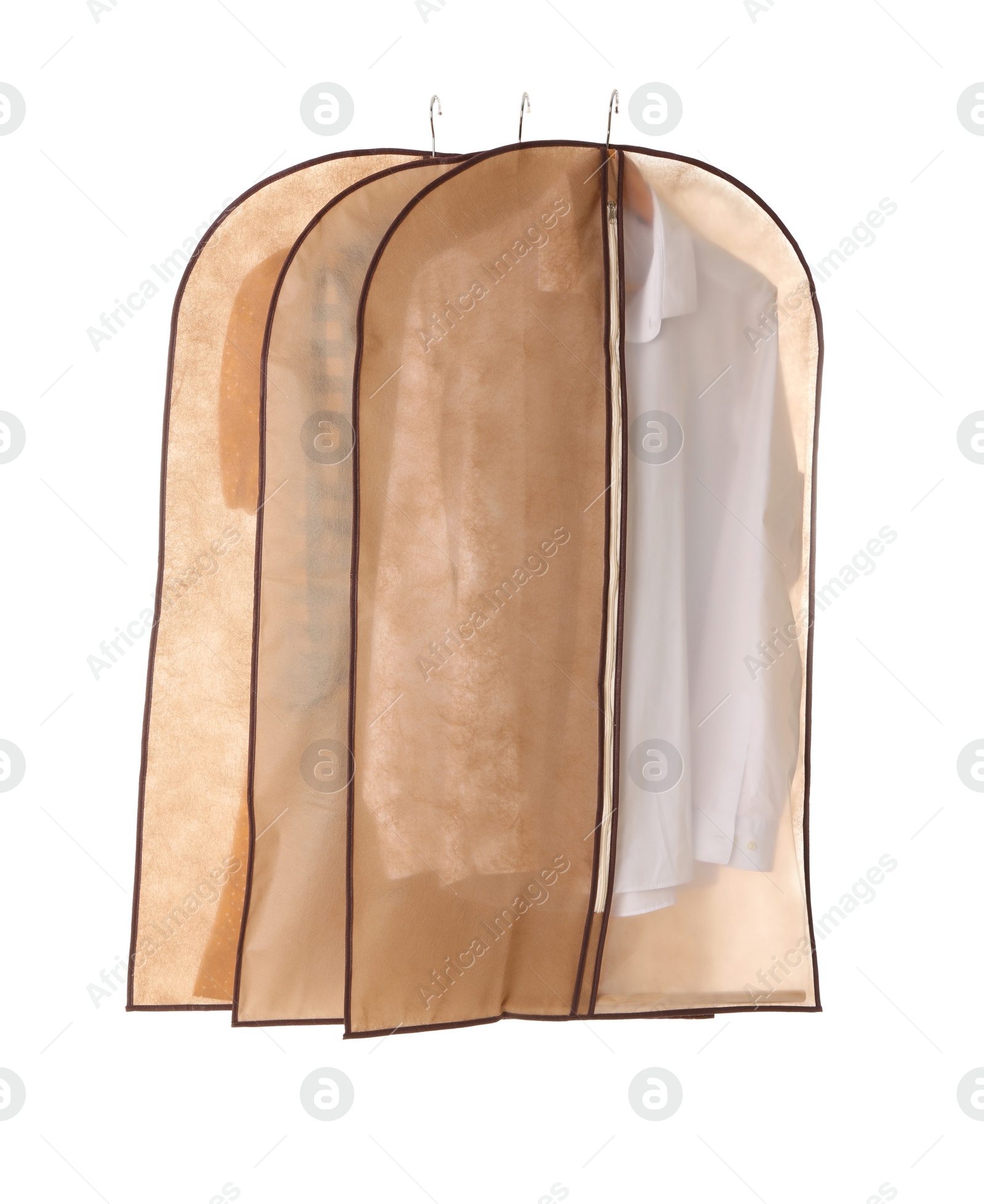 Photo of Garment bags with clothes on white background