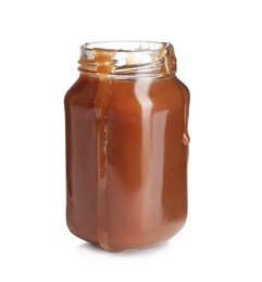 Photo of Jar of tasty caramel sauce isolated on white