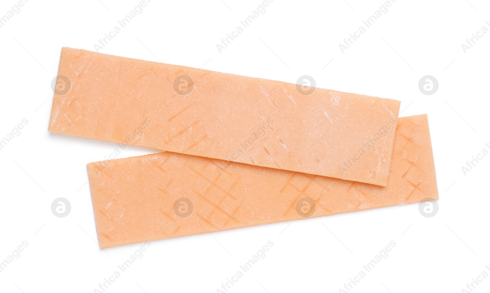 Photo of Sticks of tasty orange bubble gums isolated on white, top view