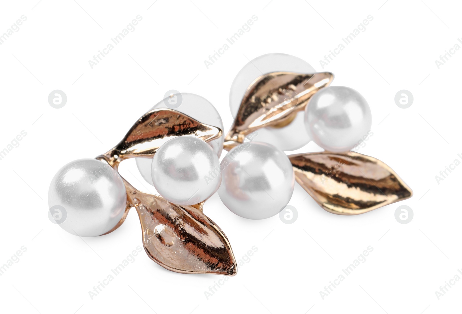 Photo of Elegant gold earrings with pearls isolated on white. Luxury jewelry