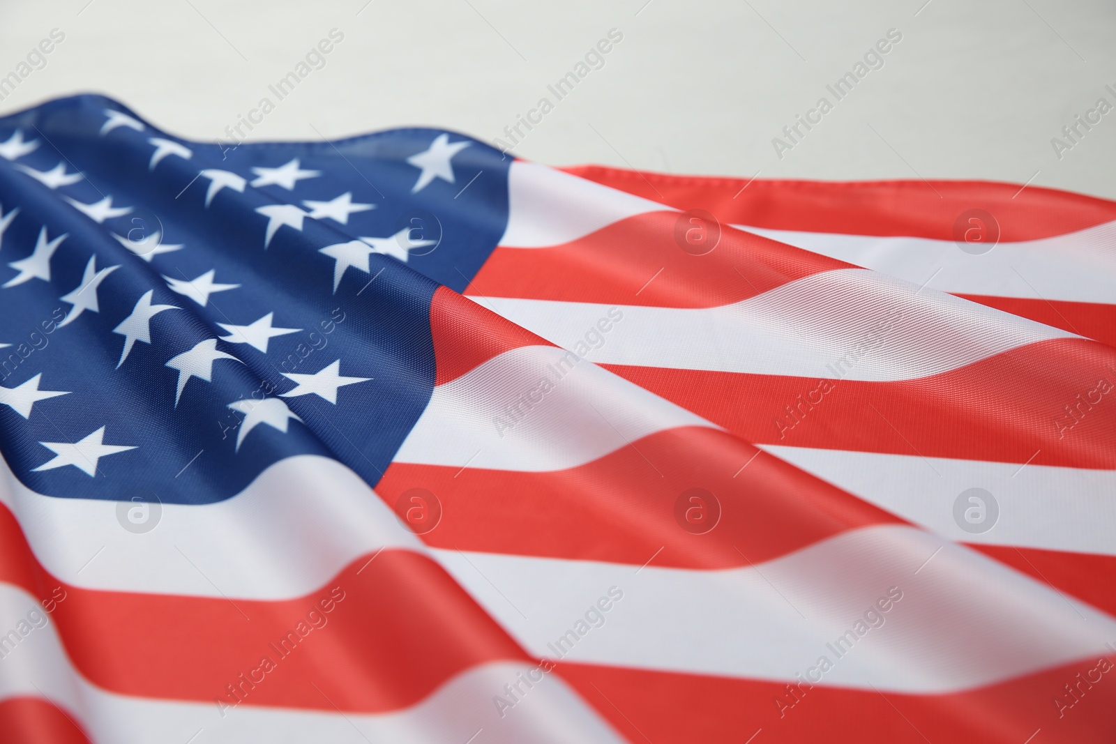 Photo of Flag of USA on white table, closeup